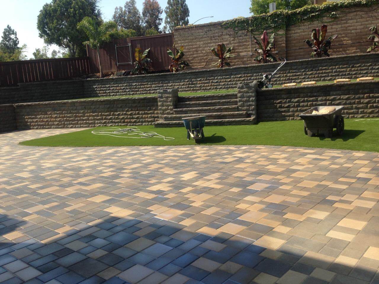 Paver walkway with artificial turf installation