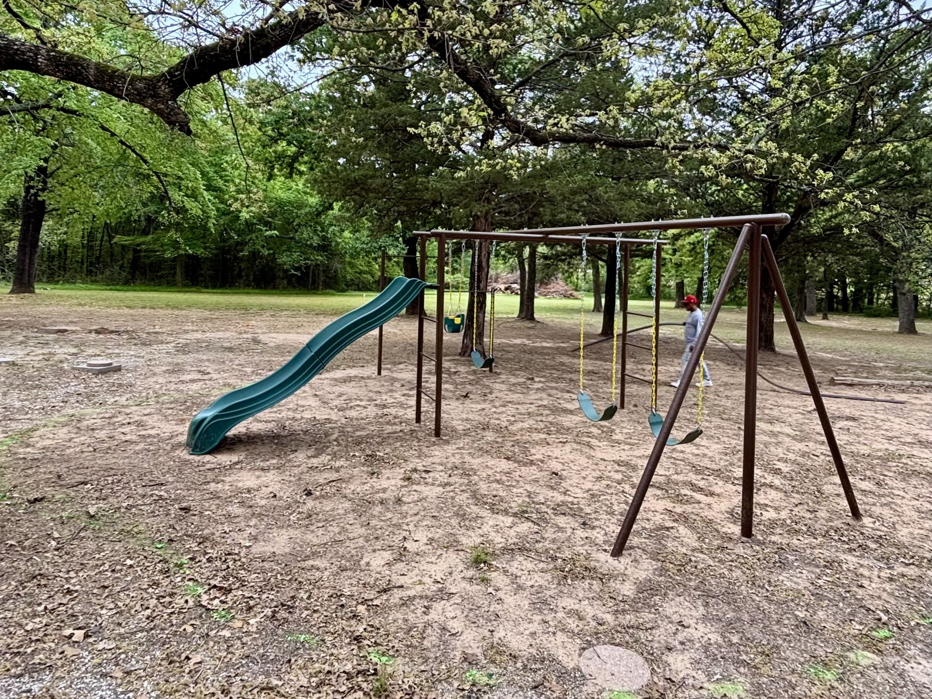 Before: bare ground playground area in DFW