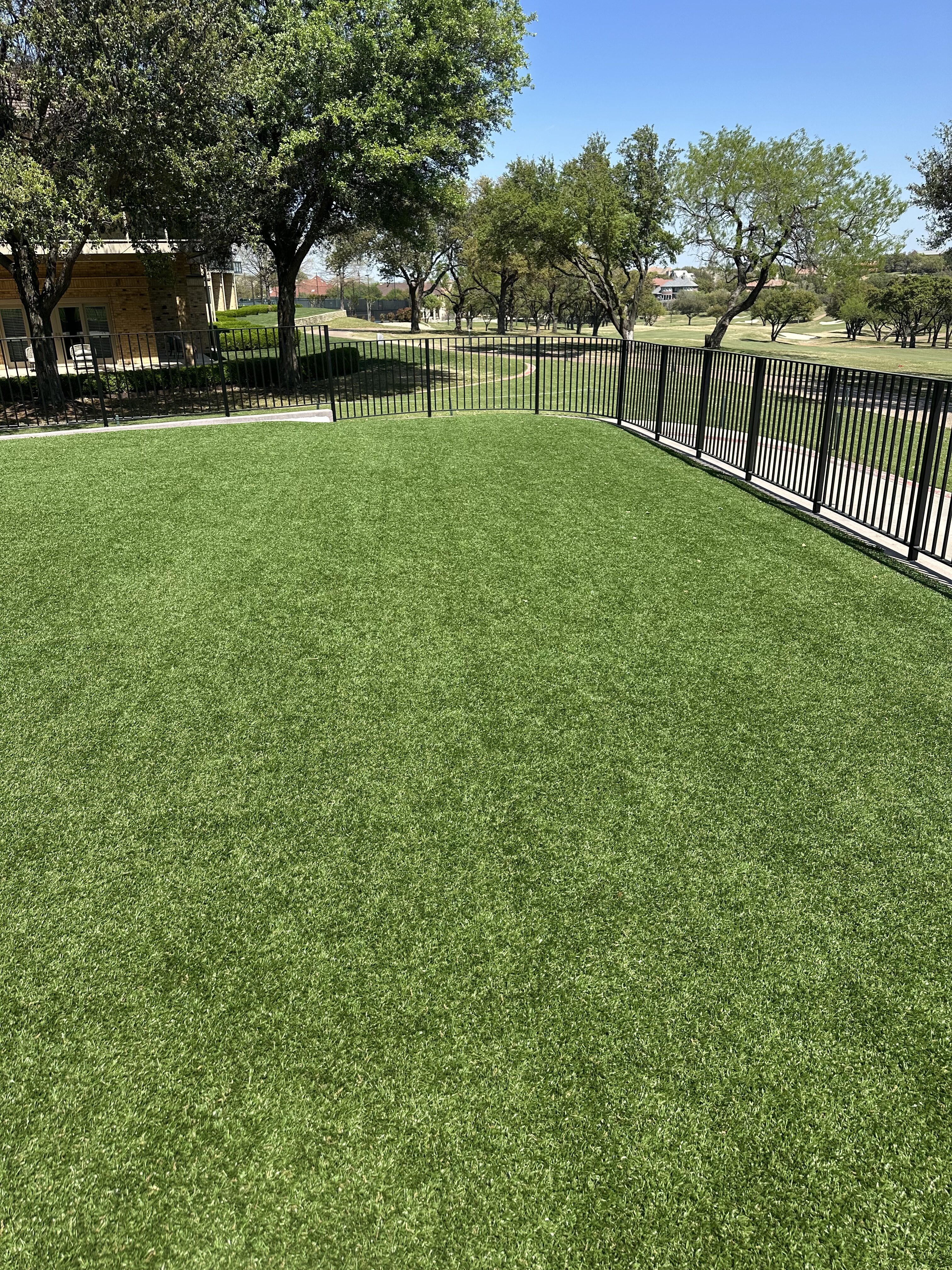 Commercial fenced lawn area - Green Forever Turf Texas