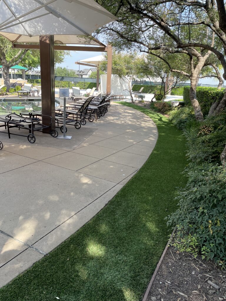 Restaurant patio with artificial turf installed over concrete