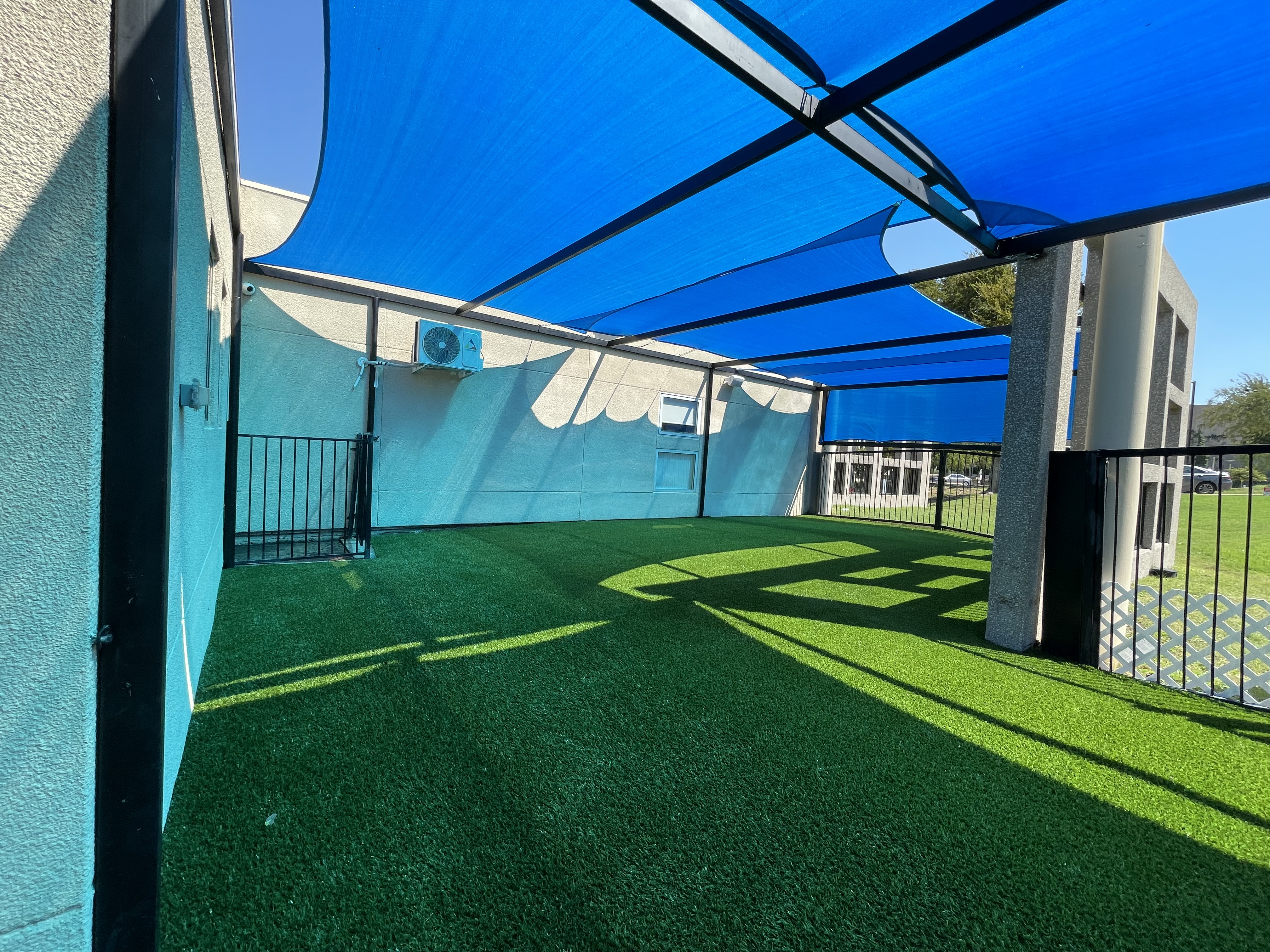 Commercial shaded patio play area - Green Forever Turf Texas