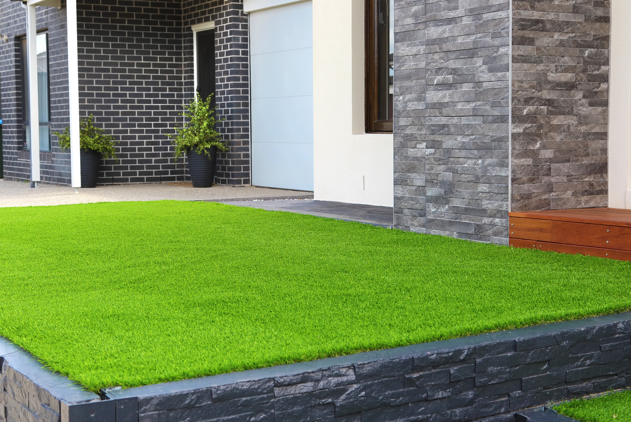 Modern front yard with artificial turf