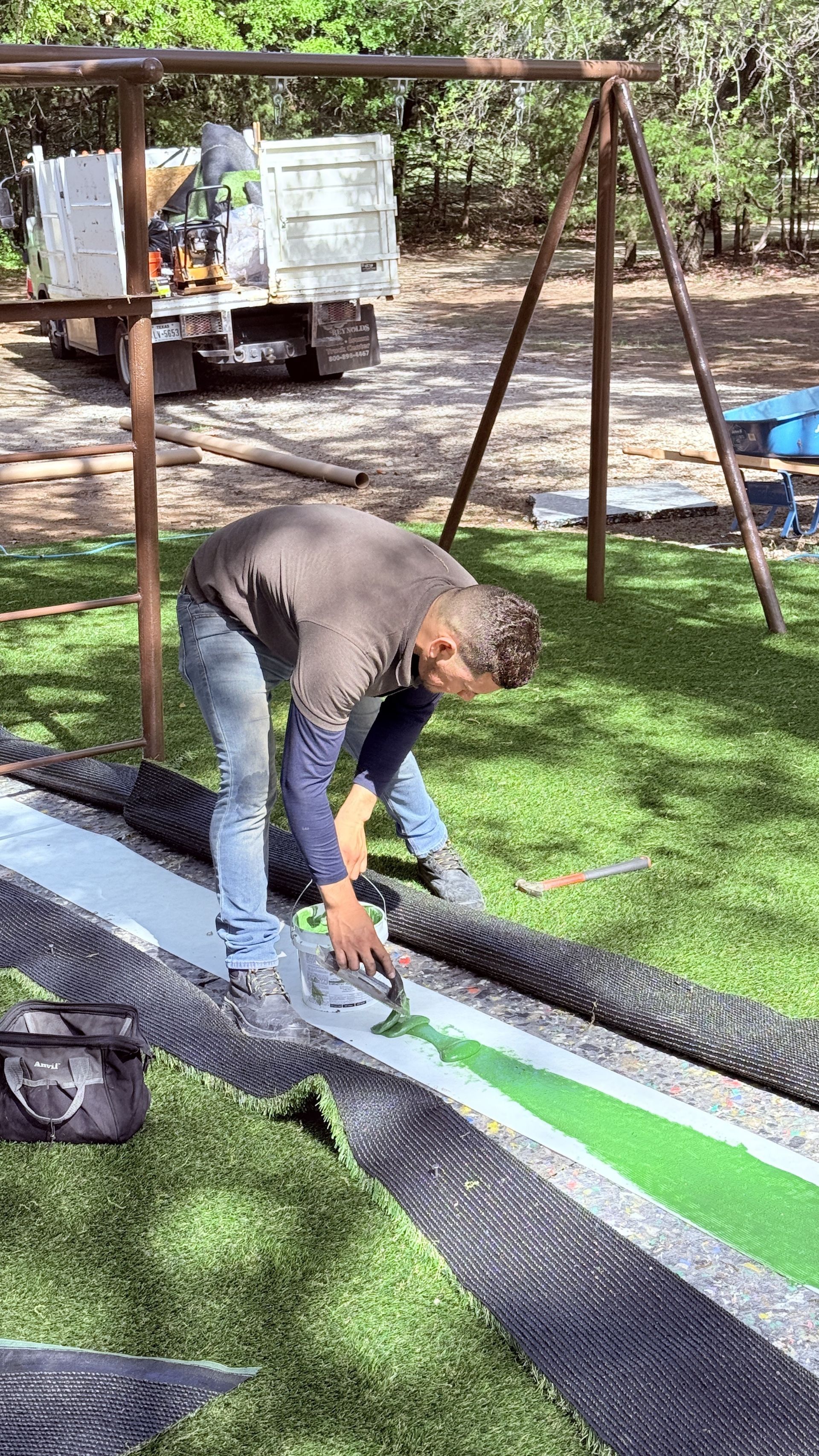 Commercial turf seaming craftsmanship on playground installation DFW